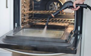 why should you use handheld steamer to clean oven